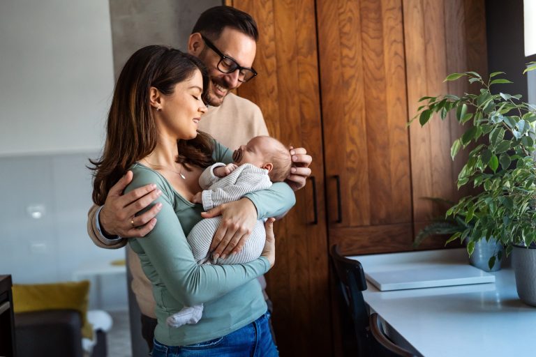 Happy parents holding newborn