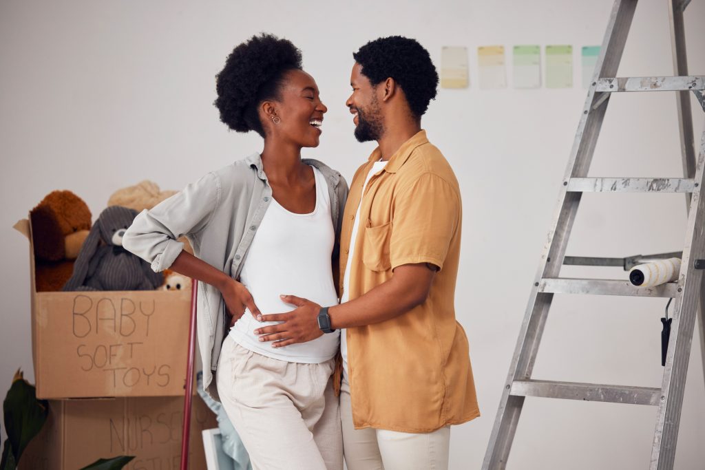 Pregnant woman with partner at home